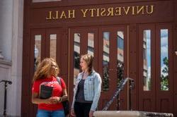 Two students outside University Hall entrance